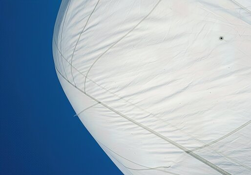 Close-up of White Sail Against a Clear Blue Sky
