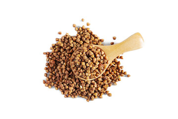 Heap of buckwheat with wooden spoon isolated on white background.