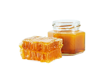 Jar with honey and honeycombs isolated on white background.