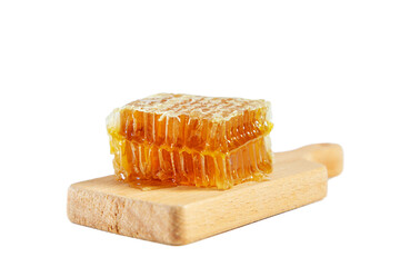 Honeycombs with honey on a wooden board isolated on white background.
