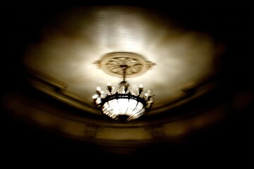Ornate chandelier, dimly lit interior