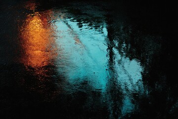 Wet pavement reflecting vibrant city lights at night