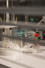 Lab equipment with flask, microscope and glass tubes. Medical laboratory interior. Chemical desk....