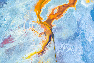 Painted mud art seen from above with drone perspective