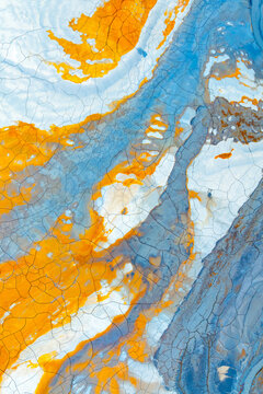 Aerial view of colorful painted mud resembling abstract art