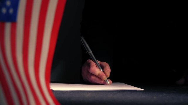 Hand signing a trade deal with American USA flag 