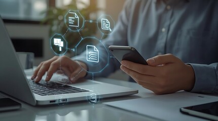 Person using laptop and phone with document icons floating above the devices on a bright desk space