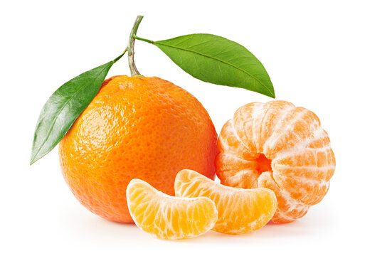 Tangerines or clementines with green leaves and slices. Without background