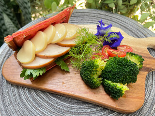 Soft tofu and slice chicken Beetroot waffle sandwiches with broccoli and cherry tomato.