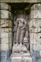 Closeup view of headless Durga Mahishasuramardini stone statue at ancient hindu Selogriyo temple,...