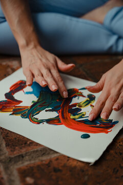 Hands painting abstract art for mindfulness