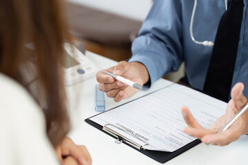 Patient Consultation. Doctor discussing health results with patient.