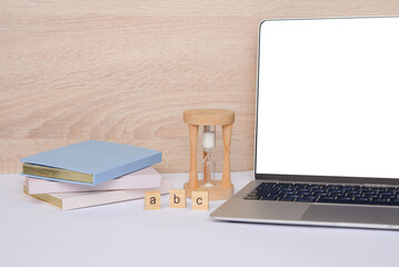 A workspace feature showcasing a laptop and hourglass, designed to boost productivity