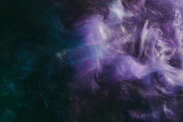 Abstract colorful background. Moving flow of purple paints, fluid liquid art, space sky