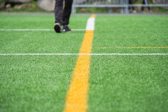Green grass and white lines of a sports field