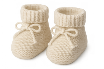 Soft knitted baby booties featuring pastel ribbons, handcrafted with gentle wool texture, resting on clean white backdrop