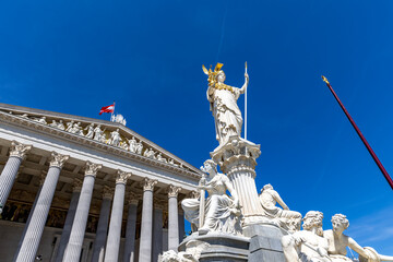 Flag Austria on the building of the Austrian Parliament. Facades of historical buildings Austria, Vienna