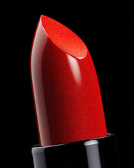Classic red lipstick with glossy finish, showcasing vibrant red tip that reflects light beautifully. This close up emphasizes rich color and smooth texture, perfect for makeup enthusiasts