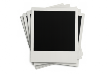 Stack of blank instant photo prints creates a nostalgic backdrop, perfect for showcasing memories or designs with a vintage touch