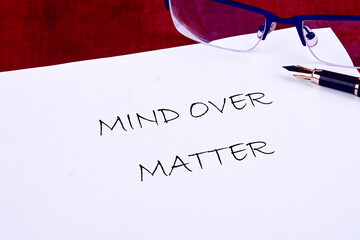 The conceptual phrase MIND OVER MATTER. The concept of beauty and health. Business and Keep an open...