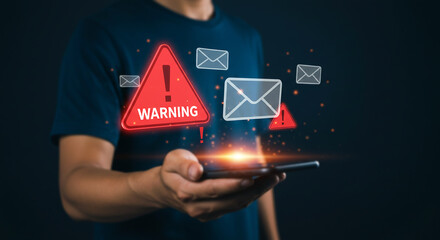 Cyber Security Alert: A person holds a smartphone, surrounded by digital warnings and mail symbols, representing a cyber security threat.