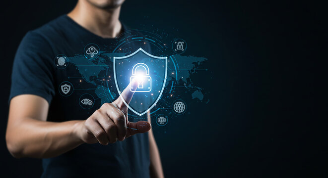 Digital Fortress: A person is using a digital touch screen interface of a virtual shield, symbolizing security and data protection in a technology landscape.
