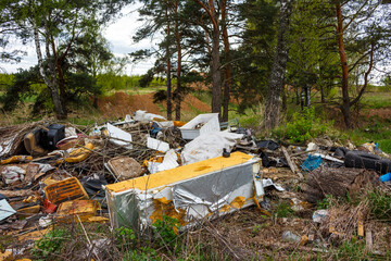 Unauthorized garbage dump in nature, illegal waste disposal