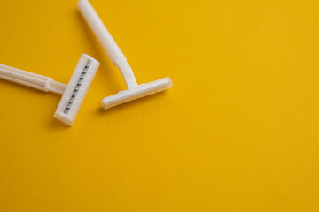 Disposable plastic razor with steel blade, men's and women's razors. Skin and body care concept. Depilation. Place for text&nbsp;