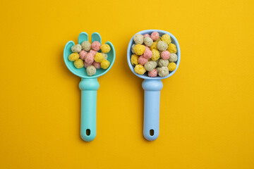 Children's toys, a shovel, a rake and crispy colorful snacks. Summer mood on the beach