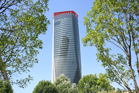 Milan, Italy - 30 June 2025: the sign of the Generali insurance headquarters is seen partially collapsed on top of the Generali Tower designed by Zaha Hadid Architects in the City Life district