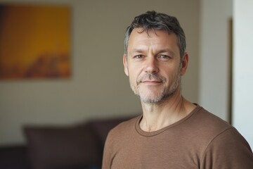 portrait caucasian man 50 years old in brown T-shirt at home background, men's health, family man