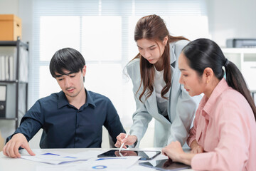 diverse business professionals engage in a dynamic brainstorming meeting, analyzing AI-powered...
