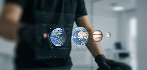 Person interacts with holographic earth projections wearing black gloves indoors. within a futuristic space exploration mission focused on unknown star systems and technological advancement
