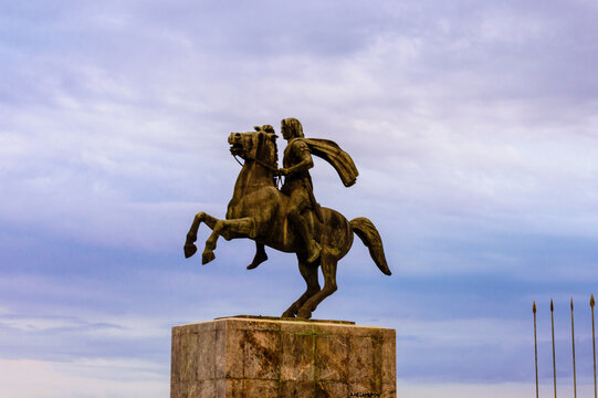 Thessaloniki, Greece - July 16 2024: Rear view of the equestrian statue of Alexander the Great with a cloudy sky background at the city promenade.
