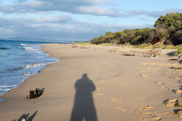 A shadow on the beach,