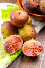 Freshly ripe figs. Healthy Mediterranean fig fruit. Fresh figs on a dark background. Beautiful blue...