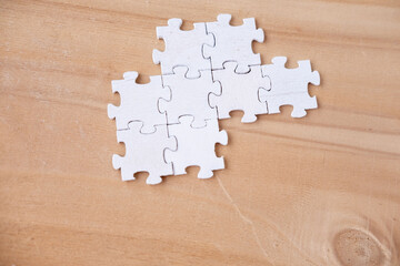 Jigsaw wooden white puzzle pieces, problem-solving and creative thinking, concept idea, level mind,...