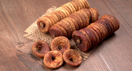 Fresh Figs or Anjeer fruit healthy vegan food concept organic dry fruits on wooden background.