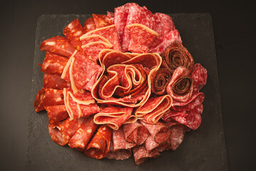 Different kinds of meat cuts on a board.
