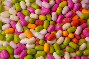 Sweet multicolored candies isolated on white background.