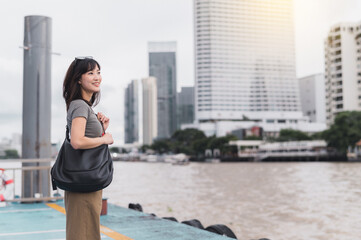 Happy solo southeast asian woman teenager blogger on world travel. Local cultural tourism...