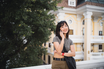 Happy solo southeast asian woman teenager blogger world travel tourism Bangkok. Local cultural...