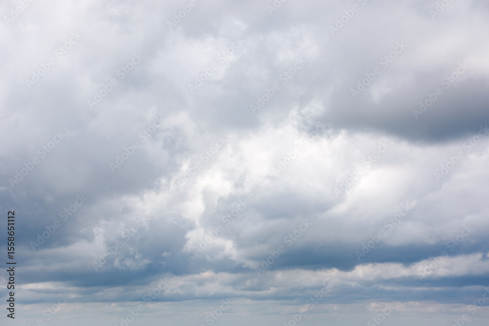 Wall mural grey cumulus cloudscape of overcast sky. dramatic meteorology background. cloudy weather forecast in