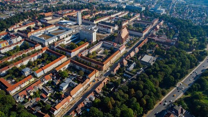 Aerial panoramic view around the old town of the city Neubrandenburg on a sunny noon in summer in Germany.