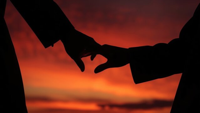 Silhouette hands. Silhouettes hands forming heart shape sunset romanti