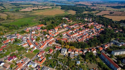 Aerial panoramic view around the old town of the city Penzlin on a sunny noon in summer in Germany.