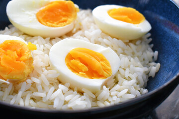 Boiled egg with rice in a bowl.