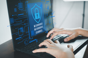 Cybersecurity concept. User typing on a laptop with a secure login interface on the screen, showing...