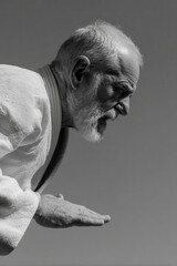 aikido practitioner in motion captured in dynamic pose face showing intense emotion left side of frame hands out of