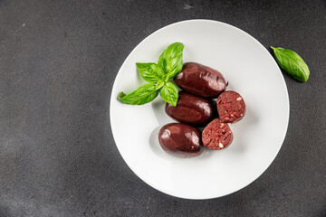 Black pudding sausage fresh delicious gourmet food background on the table rustic food top view...